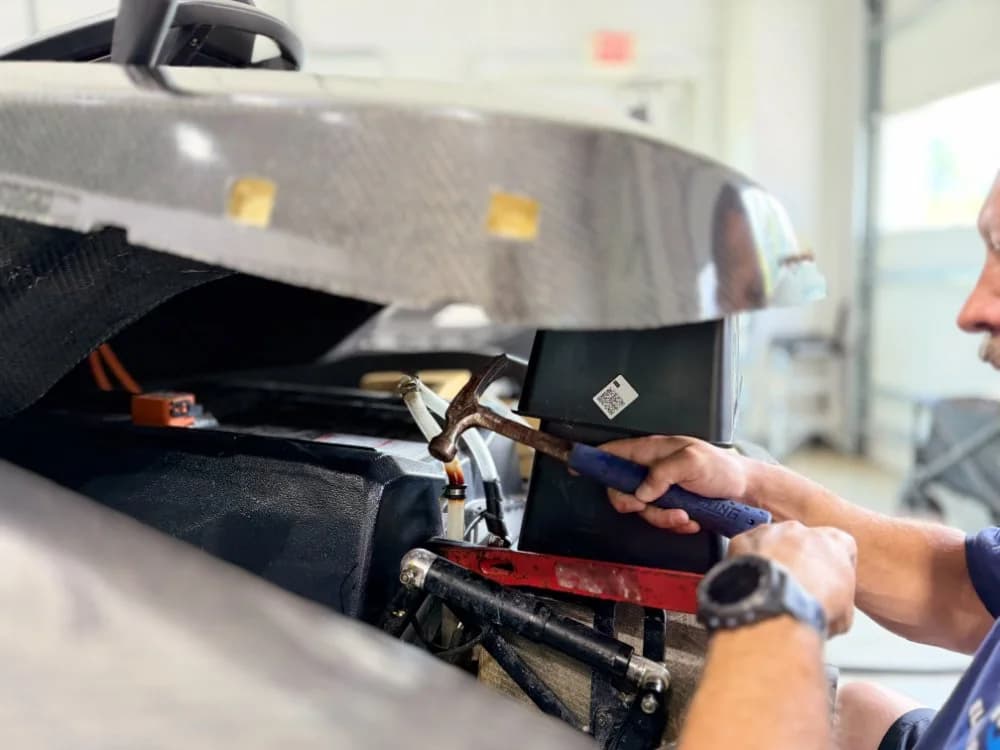 Technician working on boat electrical systems