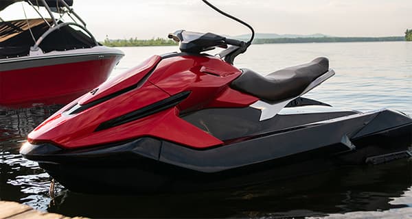 Red Taiga Orca P2 electric personal watercraft charging and docked