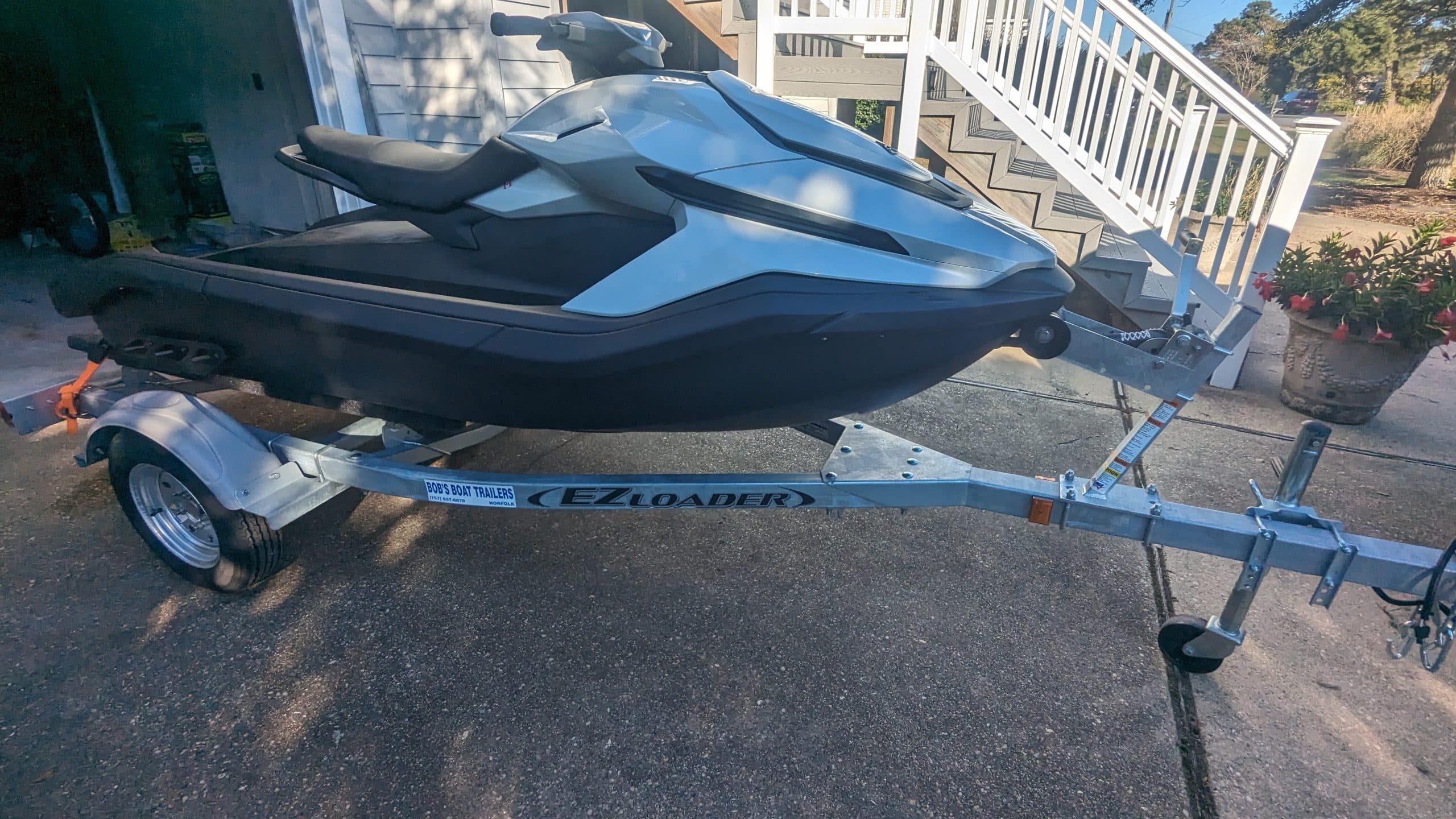 Taiga Orca P2 electric personal watercraft on a trailer outside a building.